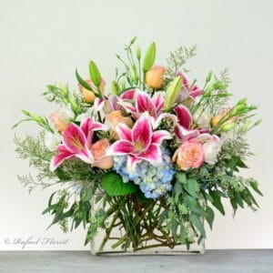 peach roses blue hydrangeas stargazer lilies contemporary flower arrangement - Color Fusion - V311