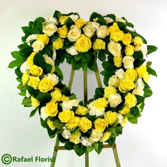 Yellow heart shape flower arrangement for funeral service san rafael ca marin