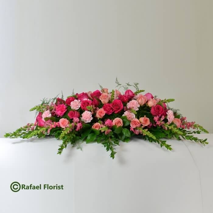 Casket flowers with pink roses and carnations