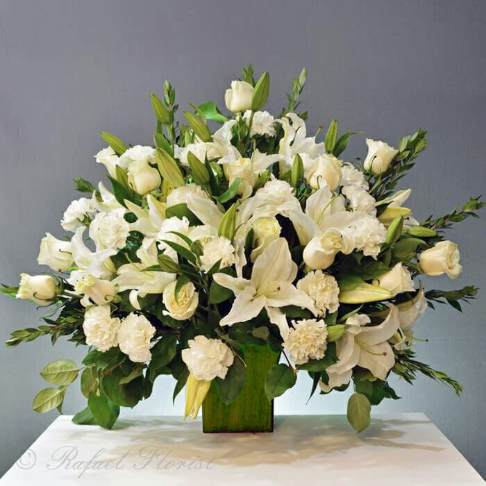 Lovely white roses and lilies design is beautiful and fragrant
